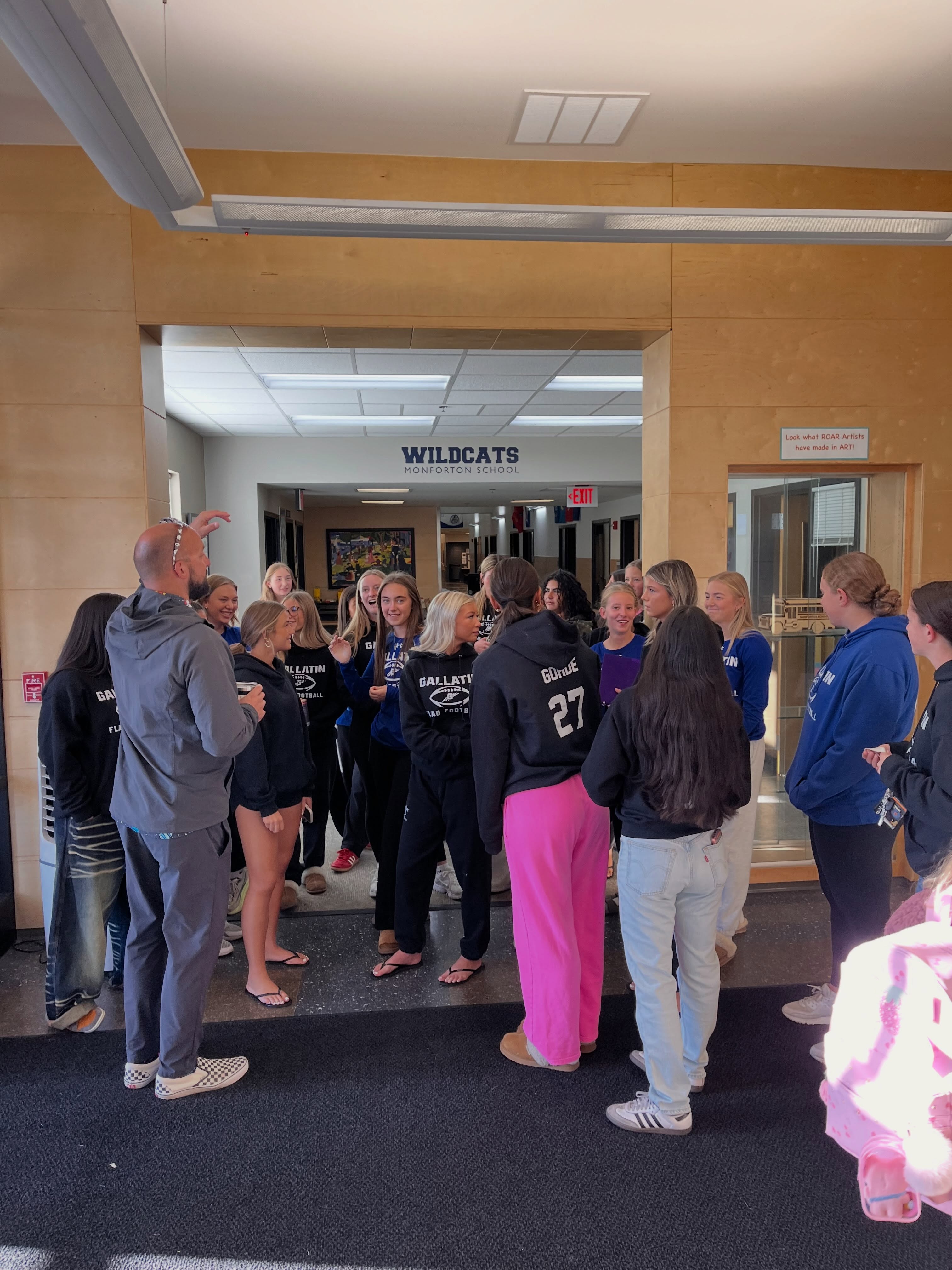 Raptor Flag Football players spent a school morning reading, making art, and dancing with students at Monforton School. Principal Fisher hosted the team for the classroom activities.