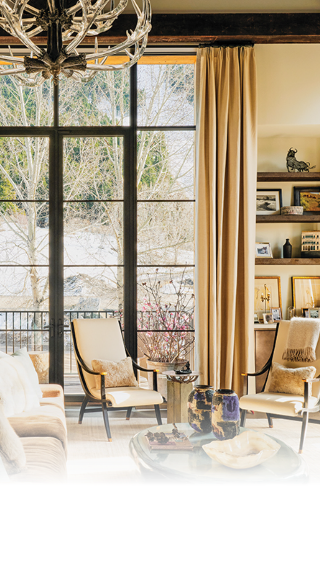 WRJ Design’s founders traded typical mountain cabin aesthetics for a custom home featuring luxury fabrics and collected antiques.